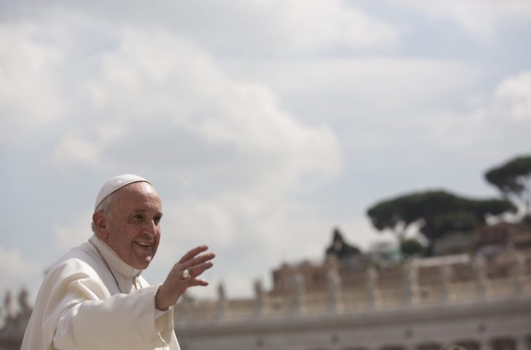 Pope Francis waves as he leaves after his weekly general audience in St. Peter's Square at the Vatican, Wednesday, April 2, 2014.  Pope Francis has hailed Pope John Paul II's legacy to Catholic faithful on the 9th anniversary of the Polish-born pontiff's death. A crowd of tens of thousands of tourists and pilgrims, including some from Poland, applauded when Francis recalled during his weekly Wednesday public audience in St. Peter's Square that John Paul died on April 2, 2005, and will soon be made a saint. Francis will lead the sainthood ceremony on April 27 in the square for both John Paul and Pope John XXIII. Francis urged the faithful to prepare for the event by "rekindling the legacy of faith that John Paul left behind." He added that the long-ailing John Paul, who led the church from 1978 until 2005, "even accomplished good with his suffering." (AP Photo/Alessandra Tarantino)