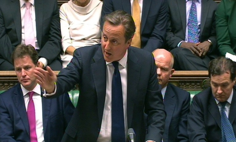 In this image taken from video, Britain's Prime Minister David Cameron, centre, speaks during a debate on Syria, in Britain's parliament, London, Thursday August 29, 2013. Britain's leaders said Thursday it would be legal under humanitarian doctrine to launch a military strike against Syria even without authorization from the United Nations Security Council, but it is not certain how much support there is for the government's resolution on Syria.  Behind Cameron are British Foreign Secretary William Hague, obscured 2nd right, and Deputy Prime Minister Nick Clegg, left. (AP Photo / PA) UNITED KINGDOM OUT - NO SALES - NO ARCHIVES