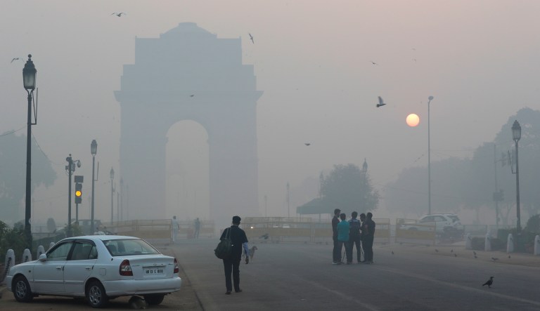 India Gate, a war memorial, is seen engulfed in smog in New Delhi, India. United Airlines suspends flight operations to New Delhi due to severe air pollution in the nation's capital. (AP Photo/Manish Swarup)