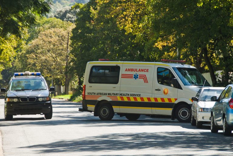 An ambulance believed to be transporting former president Nelson Mandela arrives at the home of Mandela in Johannesburg, Saturday, April 6, 2013. The South African Presidency has confirmed that Mandela has been discharged after spending nine days in hospital in Pretoria. Spokesman Mac Maharaj says the elder statesman was discharged, 