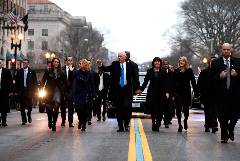 Vice President Mike Pence walks in the inauguration parade in Washington, Friday, Jan. 20, 2017, with his wife Karen and daughter Charlotte, left. (AP Photo/Alex Brandon)