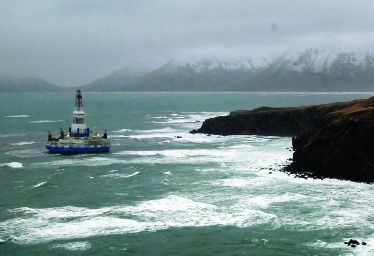 This image provided by the U.S. Coast Guard shows the Royal Dutch Shell drilling rig Kulluk aground off a small island near Kodiak Island Wednesday Jan. 2, 2013. There's no indication of a fuel leak from Kulluk, the Coast Guard said Wednesday night, Jan. 2, 2013, of a maritime accident that has refueled debate over oil exploration in the U.S. Arctic Ocean. (AP Photo/U.S. Coast Guard)
