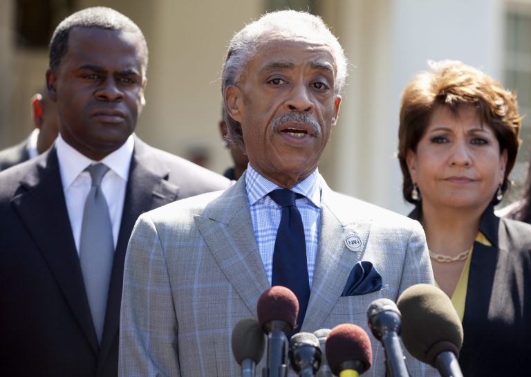 Rev. Al Sharpton, flanked by La Raza President Janet Murguia, right, and Atlanta Mayor Kasim Reed, speaks to reporters outside the White House on Monday. (AP/Carolyn Kaster)