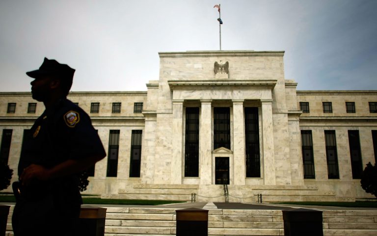 Federal Reserve Law Enforcement officers stand outside the Federal Reserve September 16, 2008 in Washington, DC. (Photo by Chip Somodevilla/Getty images)
