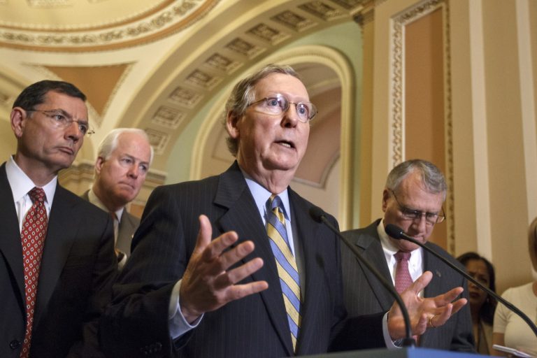 Senate Minority Leader Mitch McConnell of Ky., gestures during a news conference on Capitol Hill in Washington, Tuesday, July 24, 2012, following a political strategy session. From left are, Sen. John Barrasso, R-Wyo., Sen. John Cornyn, R-Texas, McConnell, and Senate Minority Whip Jon Kyl of Ariz.  (AP Photo/J. Scott Applewhite)