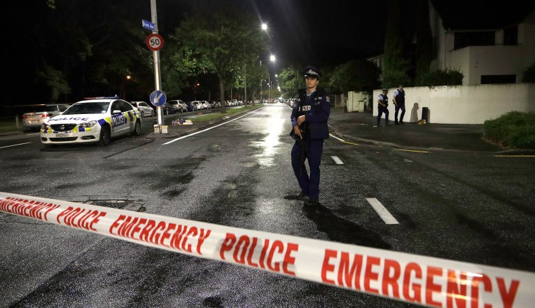 A police officer patrols at a cordon near a mosque in central Christchurch, New Zealand, Friday, March 15, 2019.