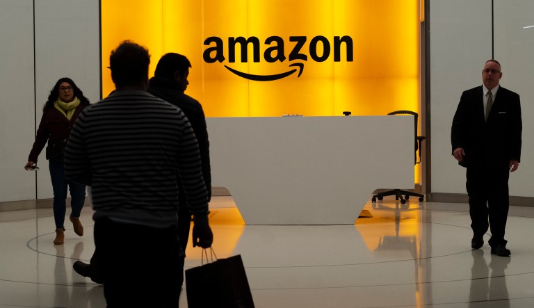 People walk into the lobby for Amazon offices Thursday, Feb. 14, 2019, in New York. Amazon will not build a new headquarters in New York City, a stunning reversal to an ambitious plan that would have brought an estimated 25,000 jobs to the city.