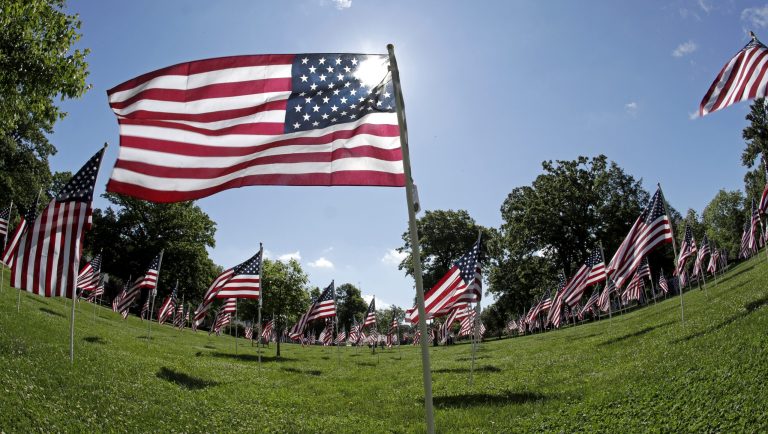American flags fly as a Field of Honor for veterans on the North Andover Common, Friday, June 14, 2019, in North Andover, Mass. 