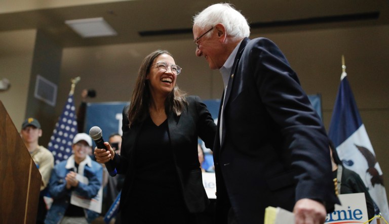 Democratic presidential candidate Sen. Bernie Sanders, I-Vt., right, laughs with Rep. Alexandria Ocasio-Cortez, D-NY, at a campaign event Sunday, Jan. 26, 2020, in Storm Lake, Iowa.