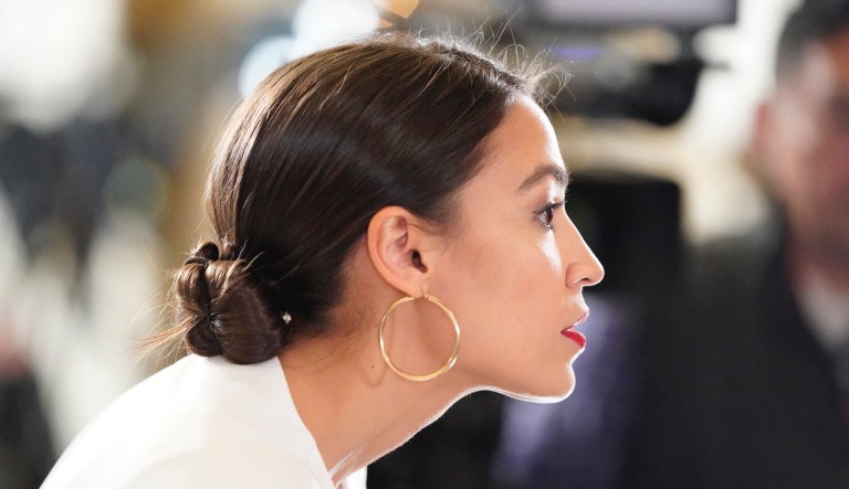 Alexandria Ocasio-Cortez listens to the State of the Union. 