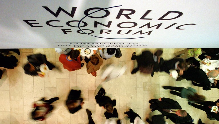 Participants gather in the lobby of the main meeting venue at the World Economic Forum in Davos, Switzerland.