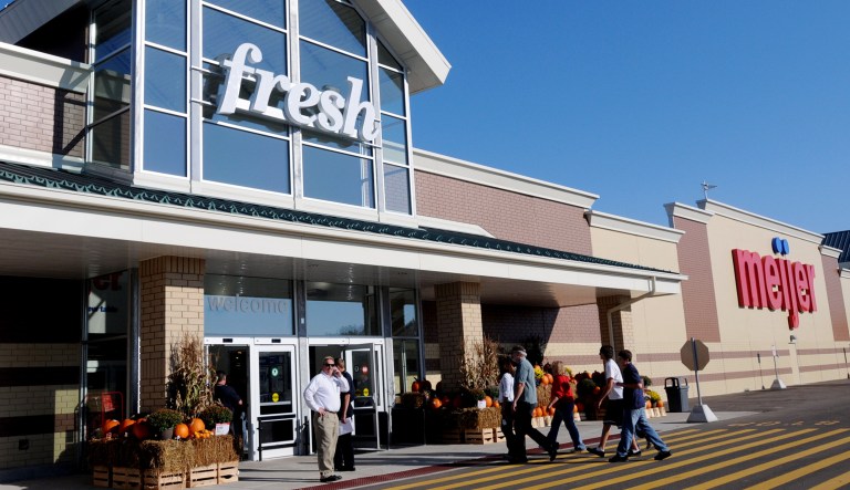 Employees and their families enter the new Meijer store in Birch Run, Michigan.
