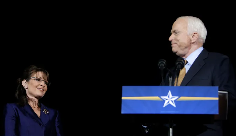 Sen. John McCain, R-Ariz., looks at Gov. Sarah Palin, R-Alaska, during an election night rally in Phoenix, Nov. 4, 2008.