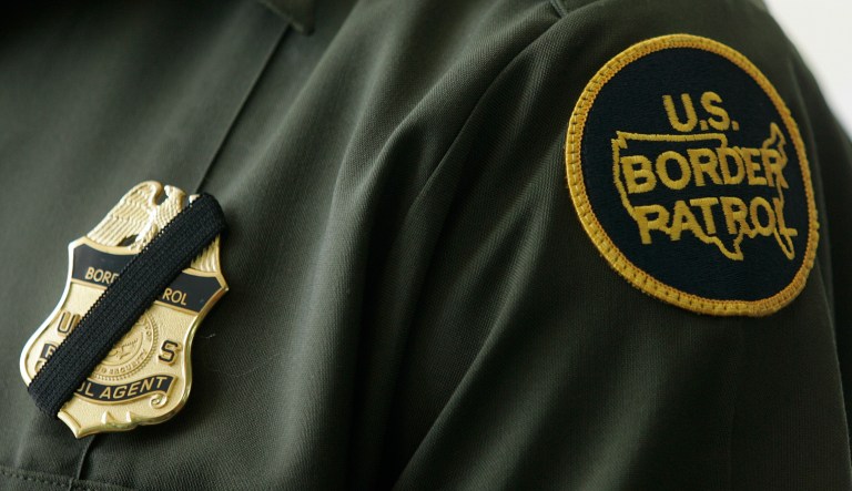 Black tape covers the badge of a United States Border Patrol Agent in the wake of the murder of agent Robert Rosas Friday, July 24, 2009, in Chula Vista., Calif.