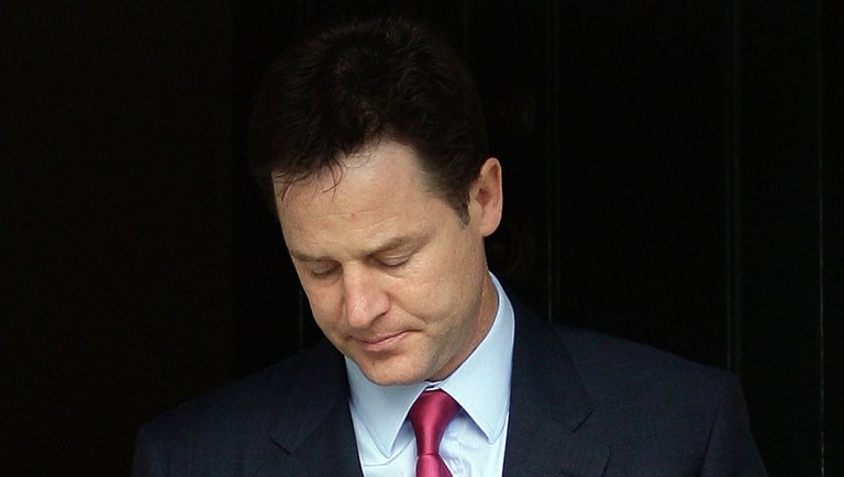 Britain's Liberal Democrat leader Nick Clegg leaves his home in London.