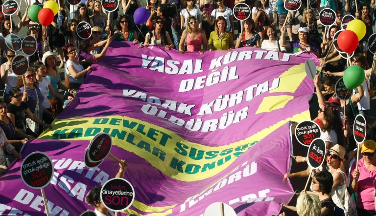 Turkish women march to protest the government's plans to ban abortion in Turkey, in Ankara, Turkey, Sunday, June 17, 2012. The banner reads :" Illegal abortion kills, not legal one."