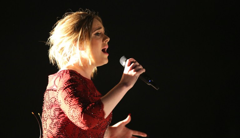 FILE - In this Feb. 15, 2016, file photo, Adele performs at the 58th annual Grammy Awards in Los Angeles. A video posted by a fan on Twitter May 29, 2016, shows the singer calling out a fan for filming her concert.