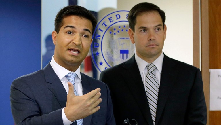 Rep. Carlos Curbelo, R-Fla., left, speaks during a news conference.