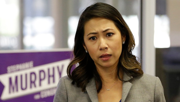 In this photo taken Oct. 18, 2016, Florida Democratic Congressional candidate Stephanie Murphy meets with voters at a senior center in Altamonte Springs, Fla.