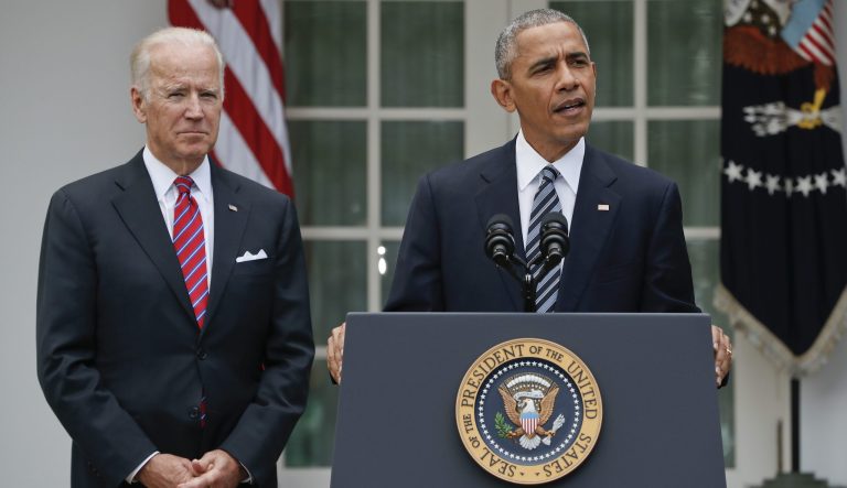 President Barack Obama, accompanied by Vice President Joe Biden, speaks in the Rose Garden of the White House in Washington, Wednesday, Nov. 9, 2016. 