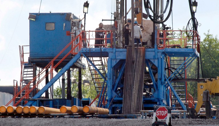 FILE - In this June 25, 2012 file photo, a crew works on a gas drilling rig at a well site for shale based natural gas in Zelienople, Pa. With two months left in President Barack Obamaâs term, his administration issued a rule Tuesday, Nov. 15, 2016, intended to clamp down on oil companies that burn off natural gas on public lands.