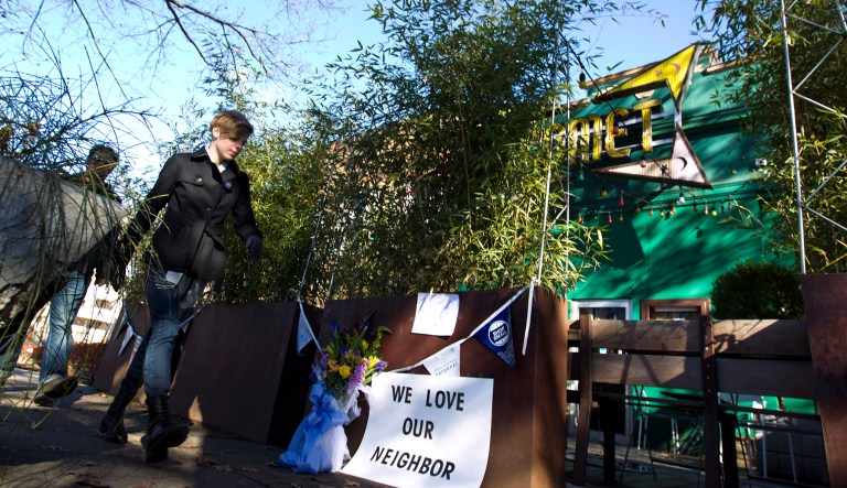 Pedestrians pass by of the front door of Comet Ping Pong pizza shop, in Washington, D.C.