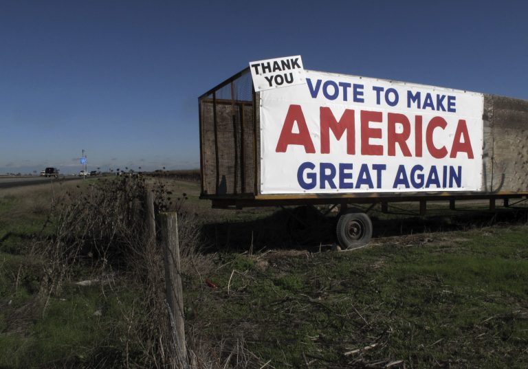 This Dec. 17, 2016 photo shows a Donald Trump campaign sign along a highway near Los Banos, Calif. A California farmer says Donald Trump's campaign vow to deport millions of immigrants who are in the country illegally pushed him into buying more equipment, cutting the number of workers heâll need during the next harvest. Others in California's farming industry say Trump's tough campaign talk targeting immigrants in the country illegally, including a vast number of farmworkers, spurred them into action, too.