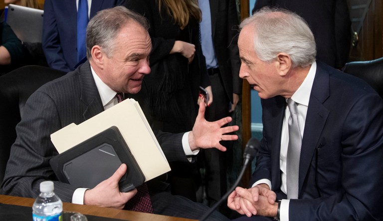 Senate Foreign Relations Committee Chairman Sen. Bob Corker, R-Tenn., right, confers with committee member Sen. Tim Kaine, D-Va., on Capitol Hill in D.C.