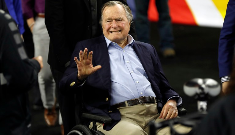 FILE - In this April 2, 2016, file photo, former President George H. W. Bush waves as he arrives at NRG Stadium before the NCAA Final Four tournament college basketball semifinal game between Villanova and Oklahoma in Houston. Houston-area media are quoting former President George H.W. Bush's chief of staff as saying that Bush has been hospitalized in Houston. 