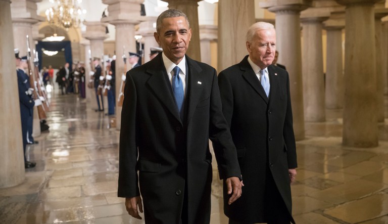 President Barack Obama and Vice President Joe Biden walk through the Crypt of the Capitol in Washington.