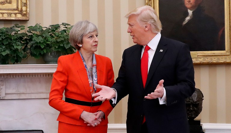President Trump (right) talks with British Prime Minister Theresa May.
