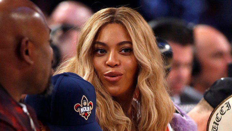 Beyonce sits at court side during the second half of the NBA All-Star basketball game.