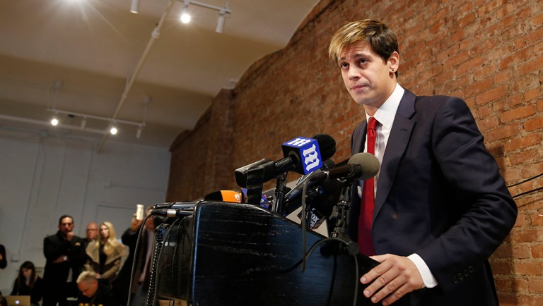 Milo Yiannopoulos speaks during a news conference in New York, Tuesday, Feb. 21, 2017. Yiannopoulos has resigned as editor of Breitbart Tech after coming under fire from other conservatives over comments on sexual relationships between boys and older men.