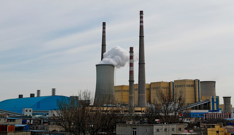 White smoke and steam rise from a coal-fired power plant in Beijing.