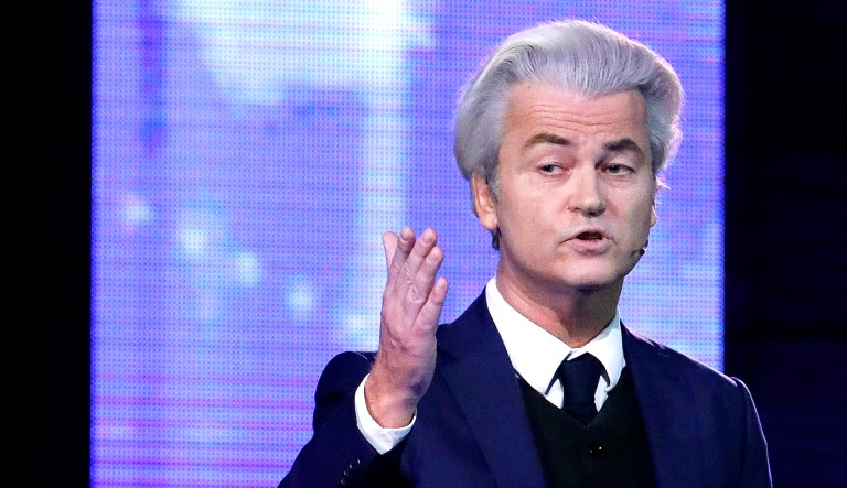 Right-wing populist leader Geert Wilders (pictured) gestures as he talks to Dutch Prime Minister Mark Rutte during a national televised debate at Erasmus University in Rotterdam, Netherlands.