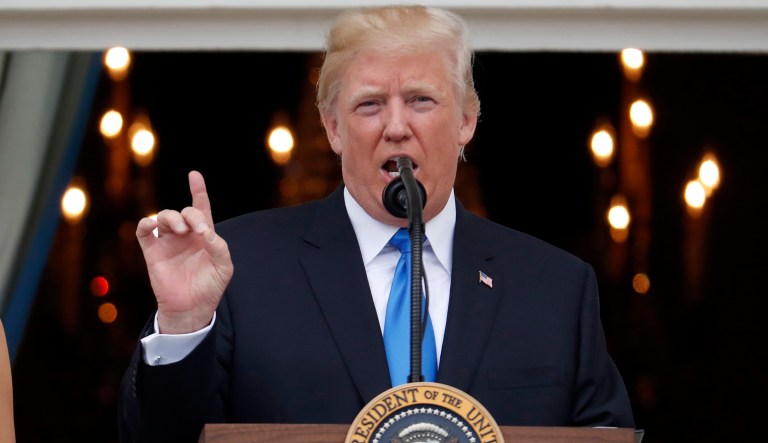 President Donald Trump speaks from the Truman Balcony at the Fourth of July picnic for military families on the South Lawn of the White House, Tuesday, July 4, 2017, in Washington.