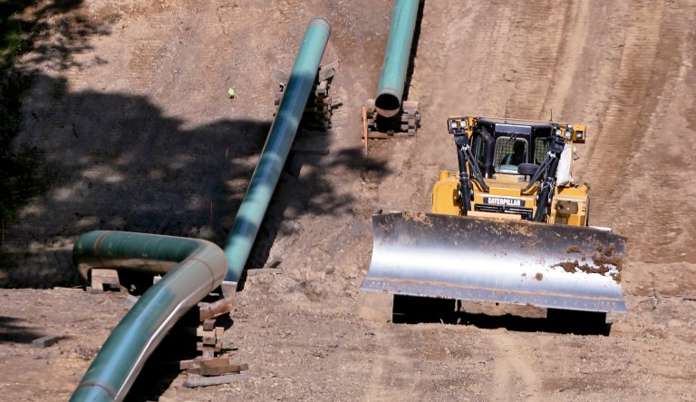 Segments of assembled pipe are lined up along a cleared section of woods where a pipeline for shale gas is under construction on Saturday, July 8, 2017 in Jackson Township, Butler County, Pa.