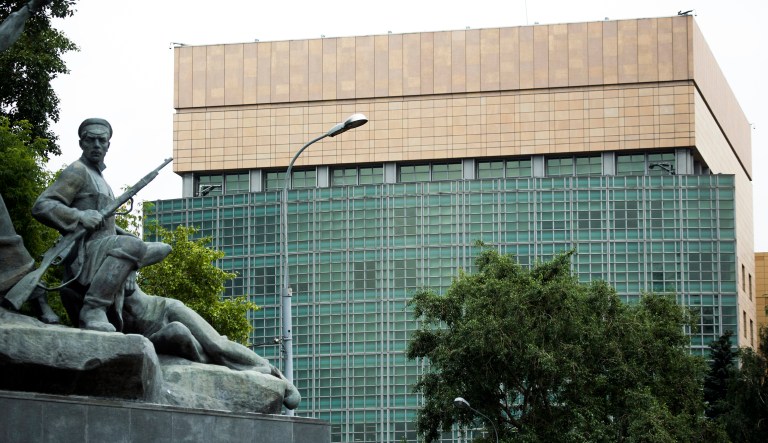 The U.S. Embassy in Moscow is pictured with a monument to Russian revolutionary workers in the foreground.