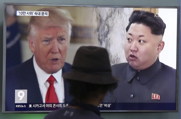 In this Aug. 10, 2017, file photo, a man watches a television screen showing U.S. President Donald Trump, left, and North Korean leader Kim Jong Un during a news program at the Seoul Train Station in Seoul, South Korea.
