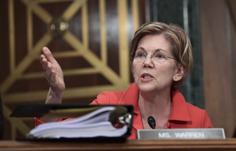 Sen. Elizabeth Warren questions why Equifax did not disclose an investigation into insider-trading claims involving an executive indicted this week when it announced, last fall, that four others had been cleared.