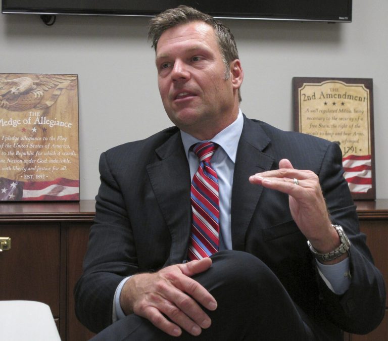 In this Monday, Oct. 16, 2017 photo, Kansas Secretary of State Kris Kobach answers questions about his run for the Republican nomination for governor during an interview at the Johnson County Republican Party's headquarters in Overland Park, Kan. Kobach is the leading Kansas for governor because of his solid base on the right and his national visibility.