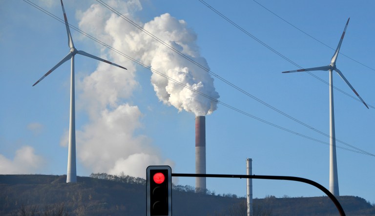 A coal-burning power plant steams behind wind generators in Gelsenkirchen, Germany while the 23rd UN Conference of the Parties (COP) climate talks end in Bonn, Germany, Friday, Nov. 17, 2017.