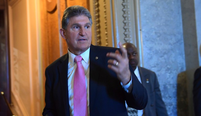 Sen. Joe Manchin, D-W.Va., walks on Capitol Hill in Washington. 