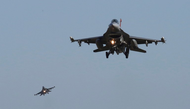 U.S. Air Force F-16 fighter jets fly over the Osan U.S. Air Base in Pyeongtaek, South Korea, Monday, Dec. 4, 2017.