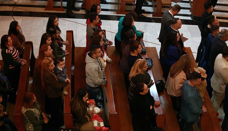 Iraqi Christians attend a Christmas Eve Mass at Our Lady of Salvation Church in Baghdad, Iraq.