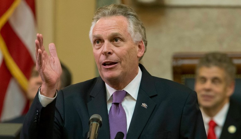 In this Jan. 10, 2018 file photo, Virginia Gov. Terry McAuliffe gestures as he addresses a joint session of the the 2018 session in the House chambers at the Capitol in Richmond, Va.