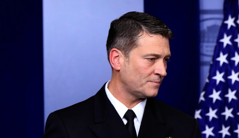 White House physician Dr. Ronny Jackson walks to the podium during the daily press briefing with White House press secretary Sarah Huckabee Sanders in the Brady press briefing room at the White House, in Washington, Tuesday, Jan. 16, 2018. (AP Photo/Manuel Balce Ceneta)