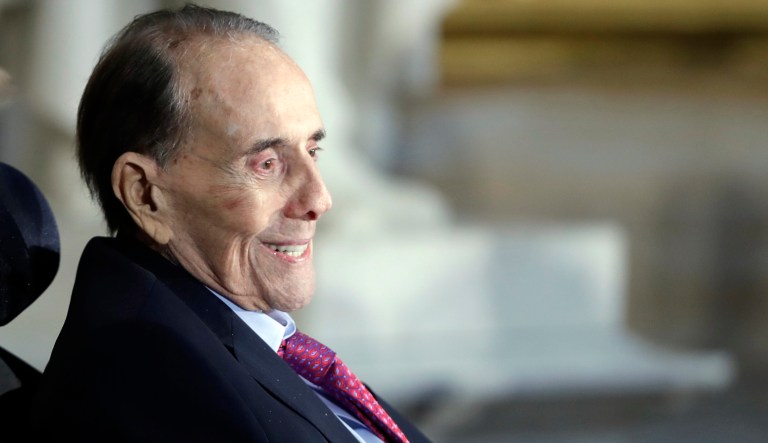 President Donald Trump, center and Vice President Mike Pence watch during a Congressional Gold Medal ceremony honoring former Senator Bob Dole on Capitol Hill, Wednesday, Jan. 17, 2018, in Washington.