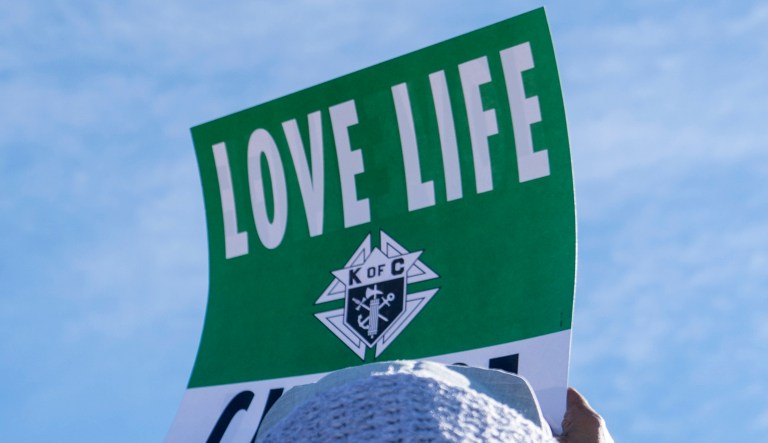 Sister Dirhas of Camp Spring, Md., left, attends an anti-abortion rally on the National Mall in Washington, Friday, Jan. 19, 2018, during the annual March for Life. Thousands of anti-abortion demonstrators gather in Washington for an annual march to protest the Supreme Court's landmark 1973 decision that declared a constitutional right to abortion.