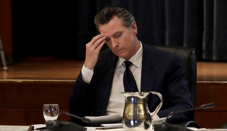 California Lt. Gov. Gavin Newsom listens to speakers during a meeting of the University of California Board of Regents in San Francisco, Jan. 24, 2018.